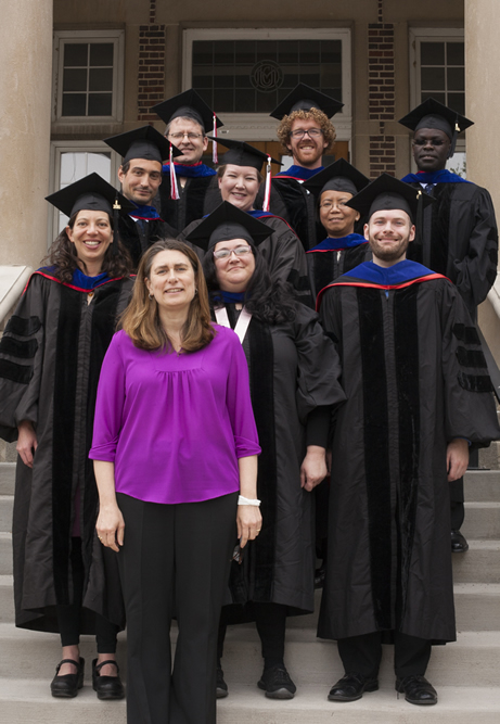 Graduates with Leslie Abadie, Graduate Program Coordinator