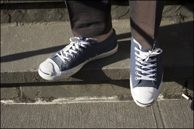 Feet wearing sneakers
