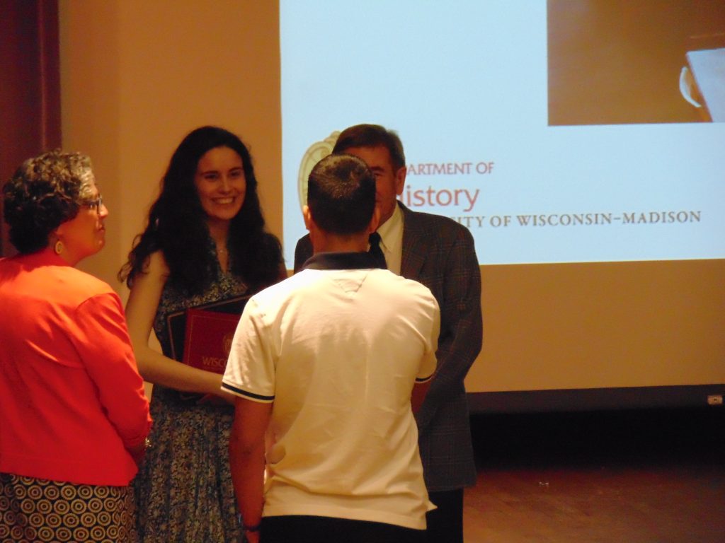 Graduating senior Whistler Somers and Professor David McDonald, with Somers’ family