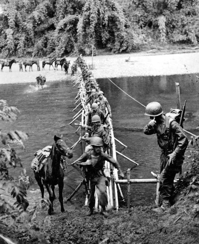 Merrill's Marauder's cross a river in Burma (now Myanmar) in 1944. U.S. Army photo.