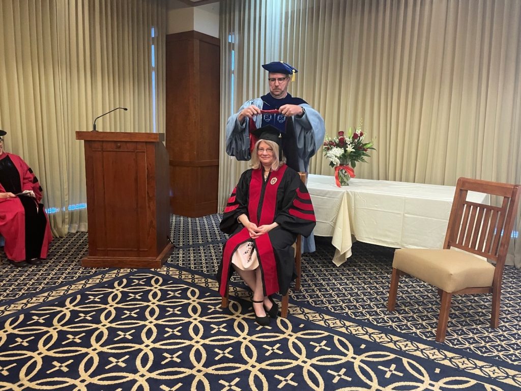 Pictured: Leslie A. Bellais, PhD with Professor John Hall