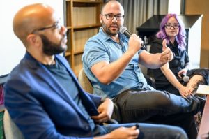 Simon Balto, assistant professor of history, ask a question about the Angola Prison chapter of the book. Photo by Althea Dotzour