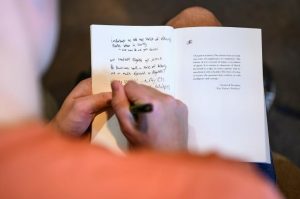 Undergraduate student Andrew Santamarina takes notes on the opening pages of his copy of “How the Word Is Passed." Photo by Althea Dotzour