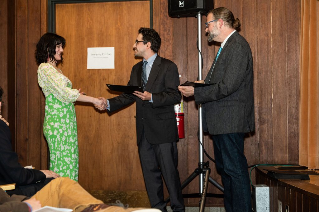 Professor Daniel Stolz and Undergraduate Advisor Scott Burkhardt congratulate graduates and hand them their commemorative certificates.