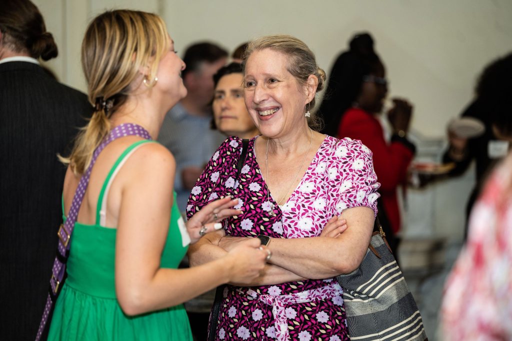 History Department Chair, Professor Anne Hansen, celebrates with graduates at the reception.
