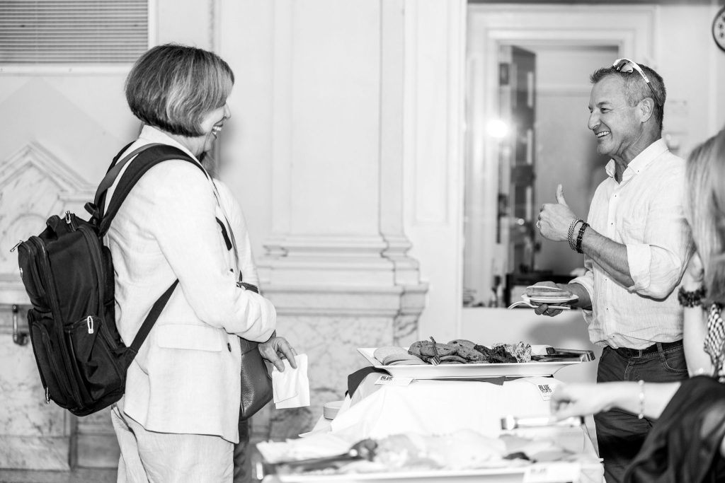 Professor Mary Lou Roberts celebrates with graduates and their families at the reception.