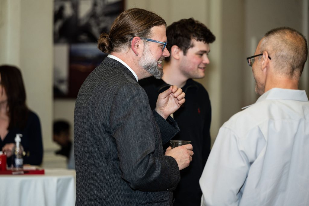 History staff celebrate with graduates at the reception.